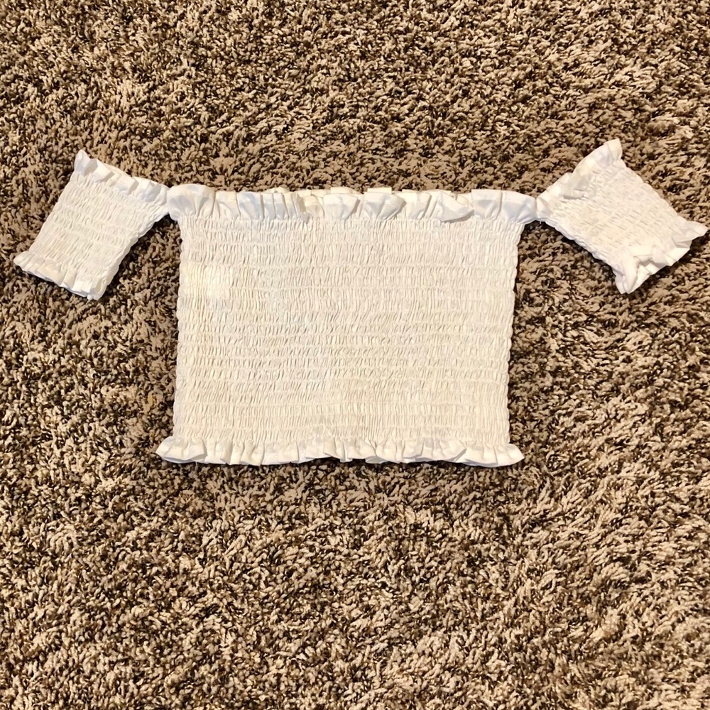 Tight, white, crop top with small sleeves!